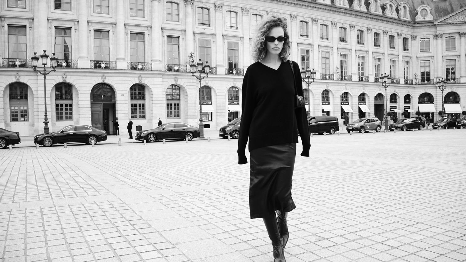 Black leather tube skirt and black v-neck sweater